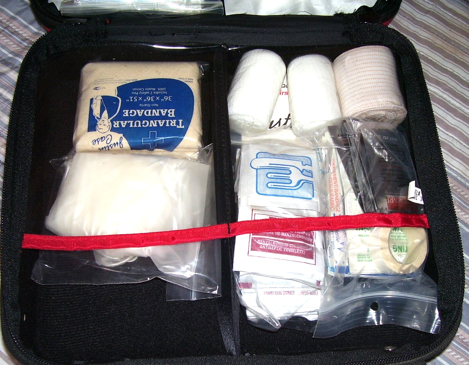 FIRST AID KIT FOR USE AT HOME; WORK; SCHOO; AUTOMOBILE / HARD ZIPPERED CASE